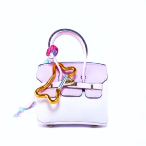 Dispenser sacchetti igienici per cani Barkin in vari colori ispirato a una borsa di lusso