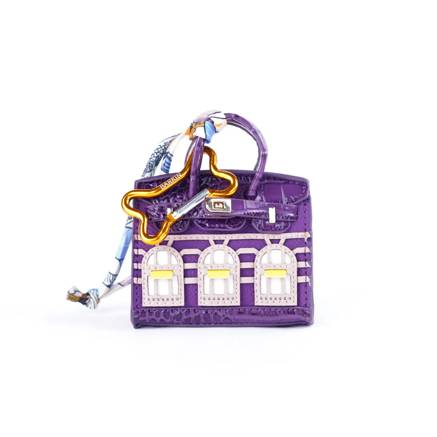 Dispenser sacchetti igienici per cani Barkin ispirato a una borsa di lusso agganciato al guinzaglio