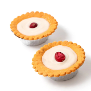 Pasticcino artigianale per cani Bakewell Tart ricetta naturale senza cereali con glassa e mirtillo rosso.